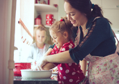 mom baking with daughters