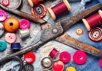 Thread, buttons, and scissors mend and repurpose clothes.