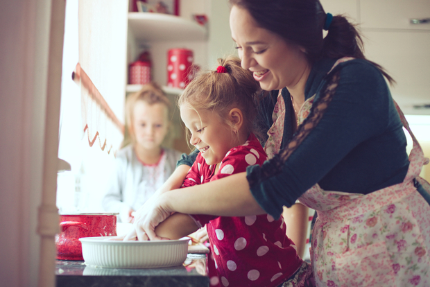 mom baking with daughters