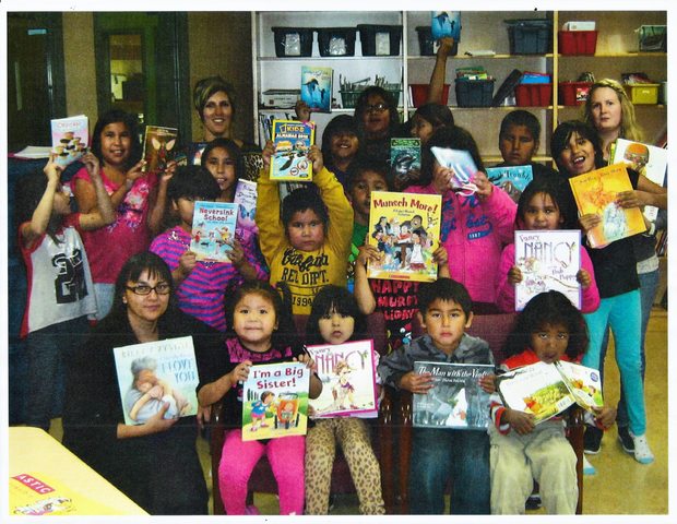 Children and staff from a school in Aroland, Canada‬ with their Books With No Bounds shipment
