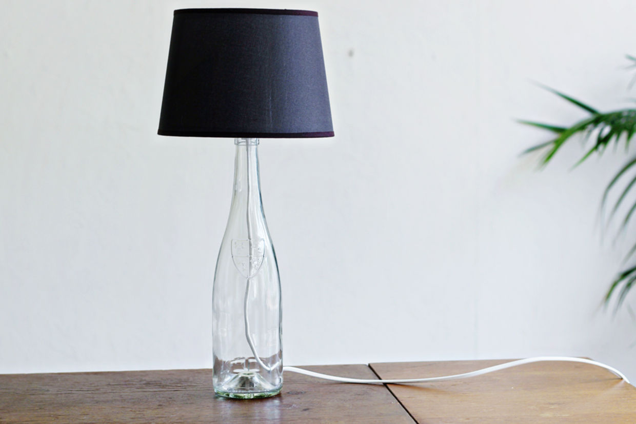 lamp made from upcycled bottle is a diy home decor item