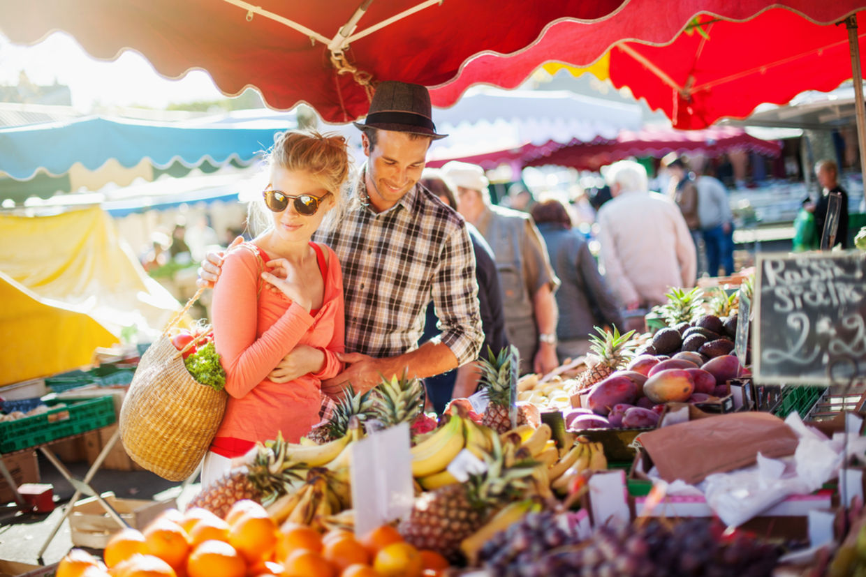 Couple looking at fruits in farmer's market
