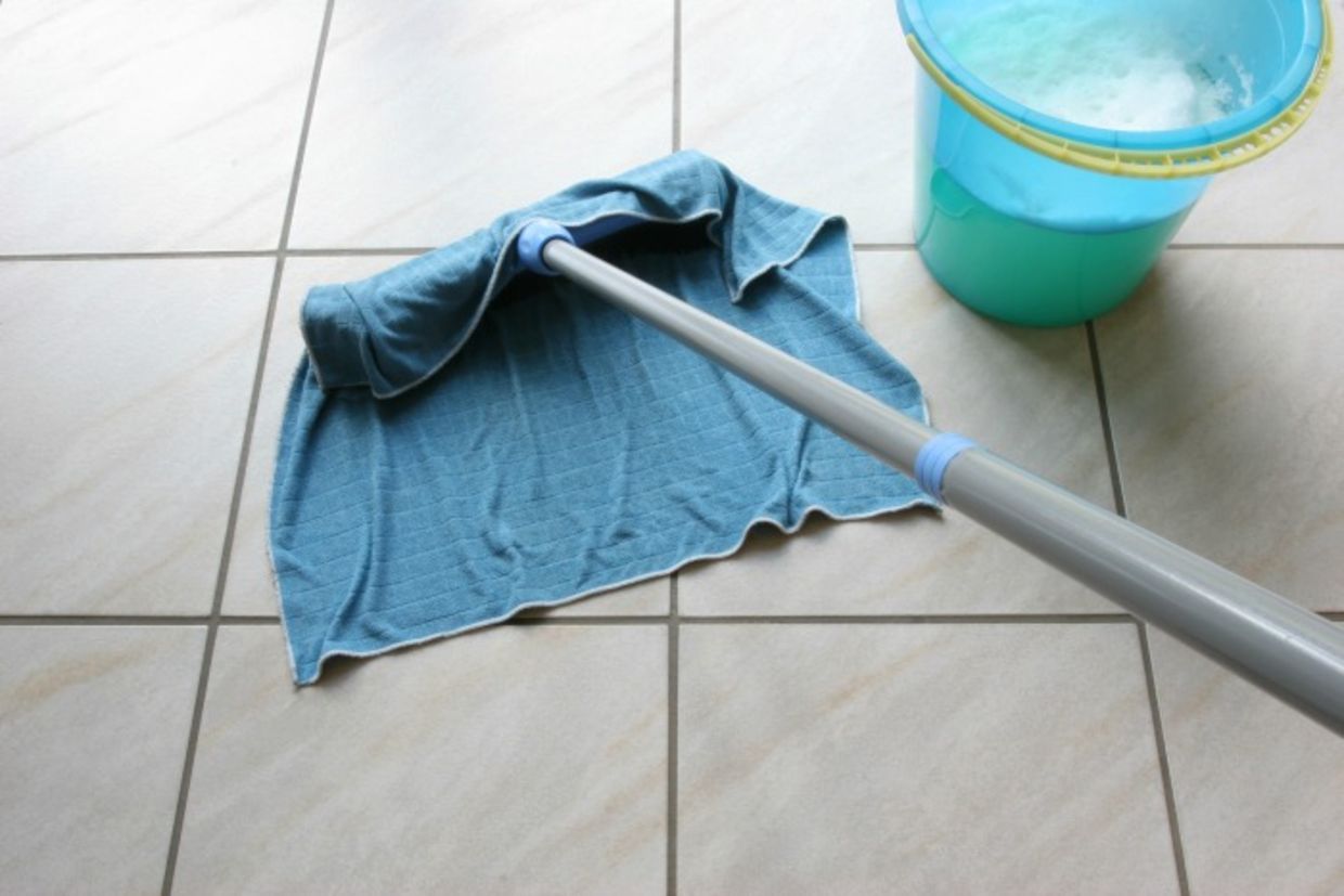 Cleaning floor with rag