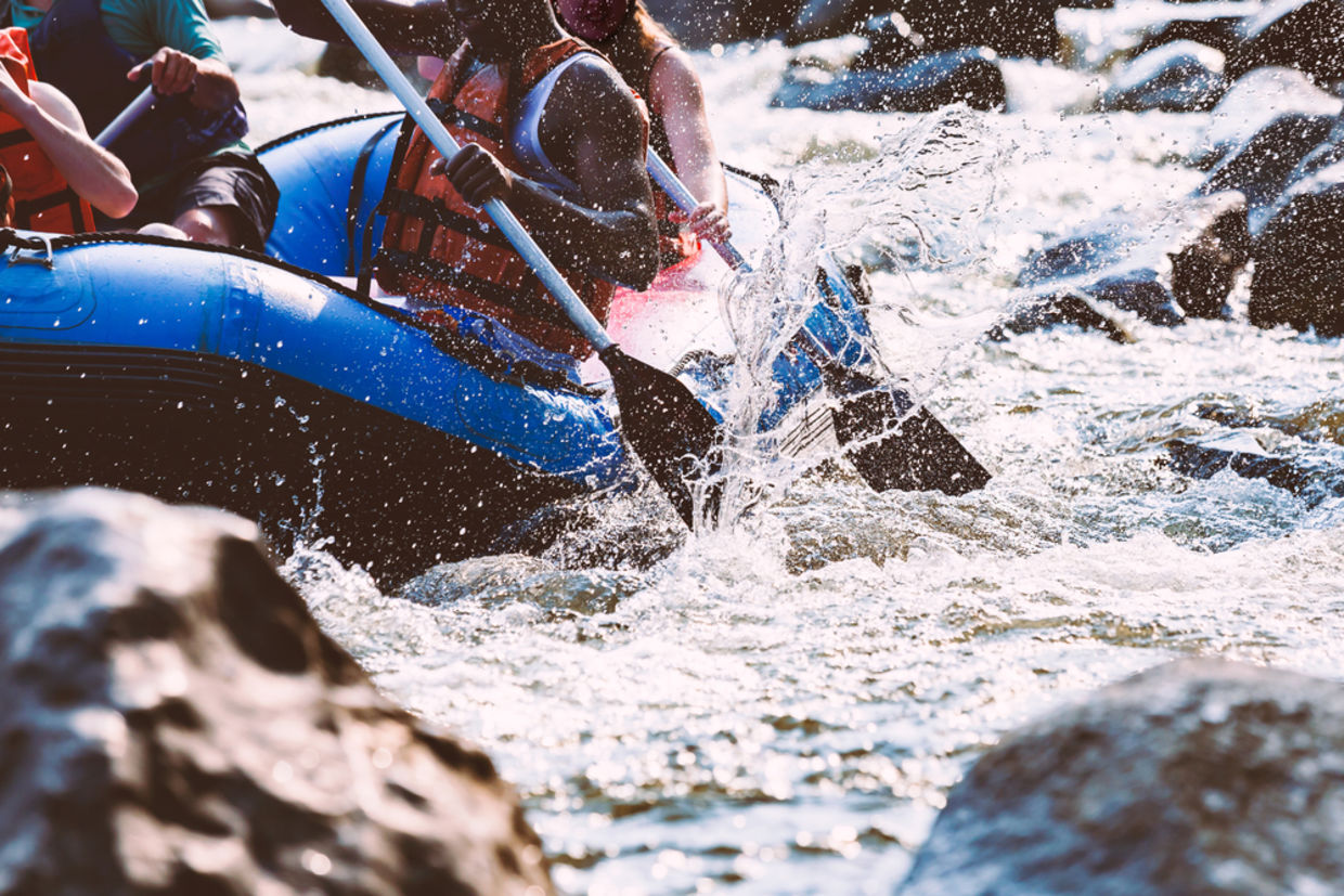 take a risk - Close-up of young person rafting on the river