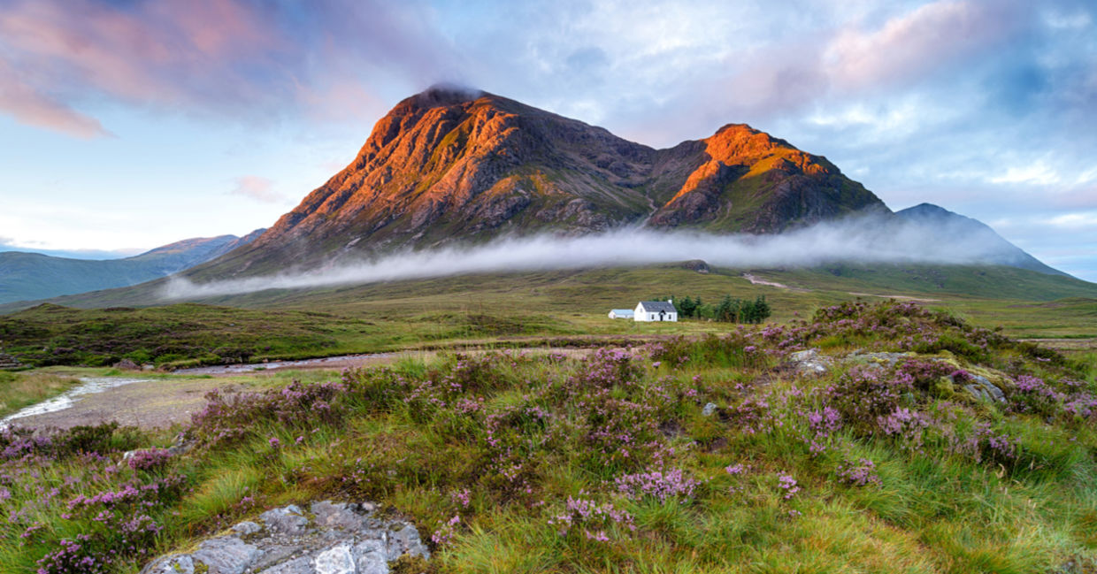 Sunrise over the mountain tops at Glencoe in the highlands of Scotland