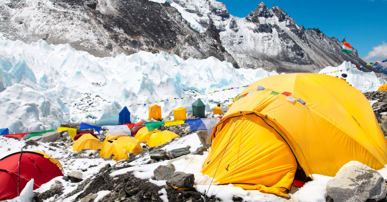 Bright yellow tents in Mount Everest base camp, Khumbu glacier and mountains, sagarmatha national park, trek to Everest base camp