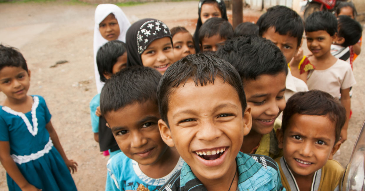 A group of smiling Indian children.
