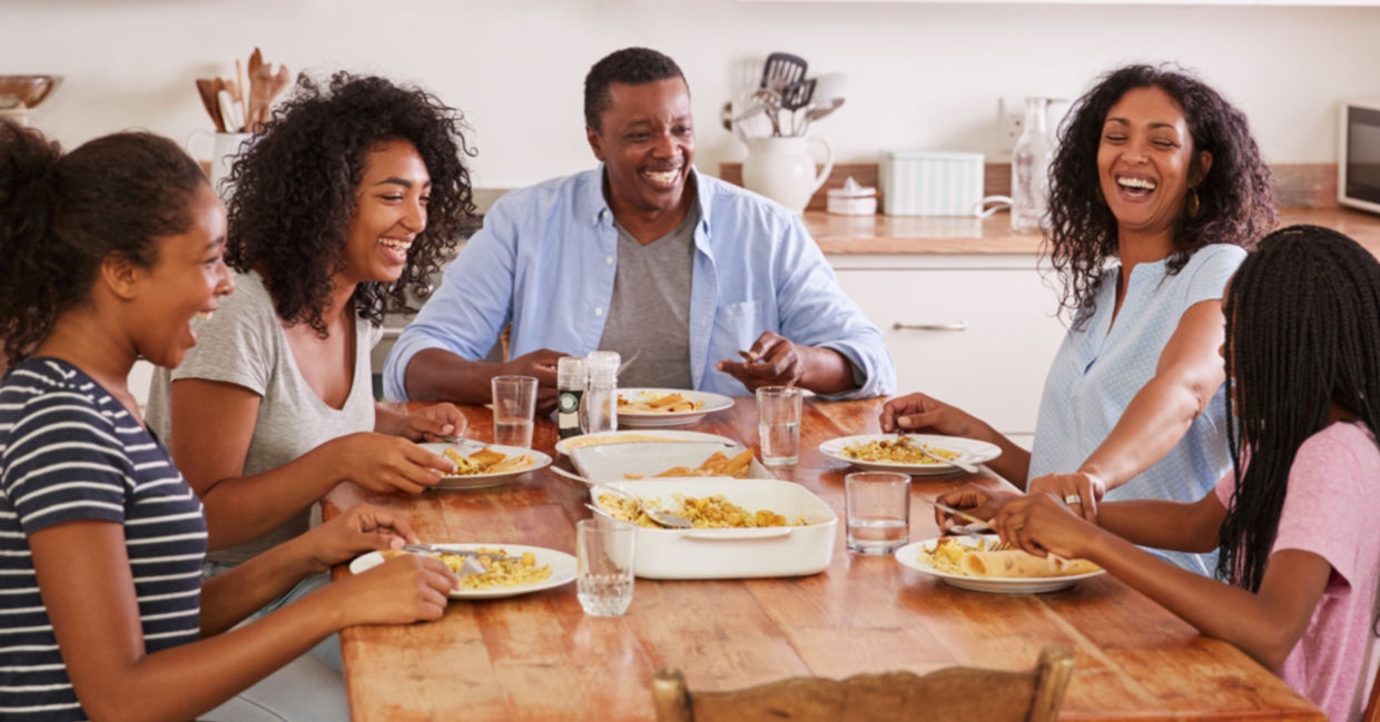 A family eating together promotes health benefits.