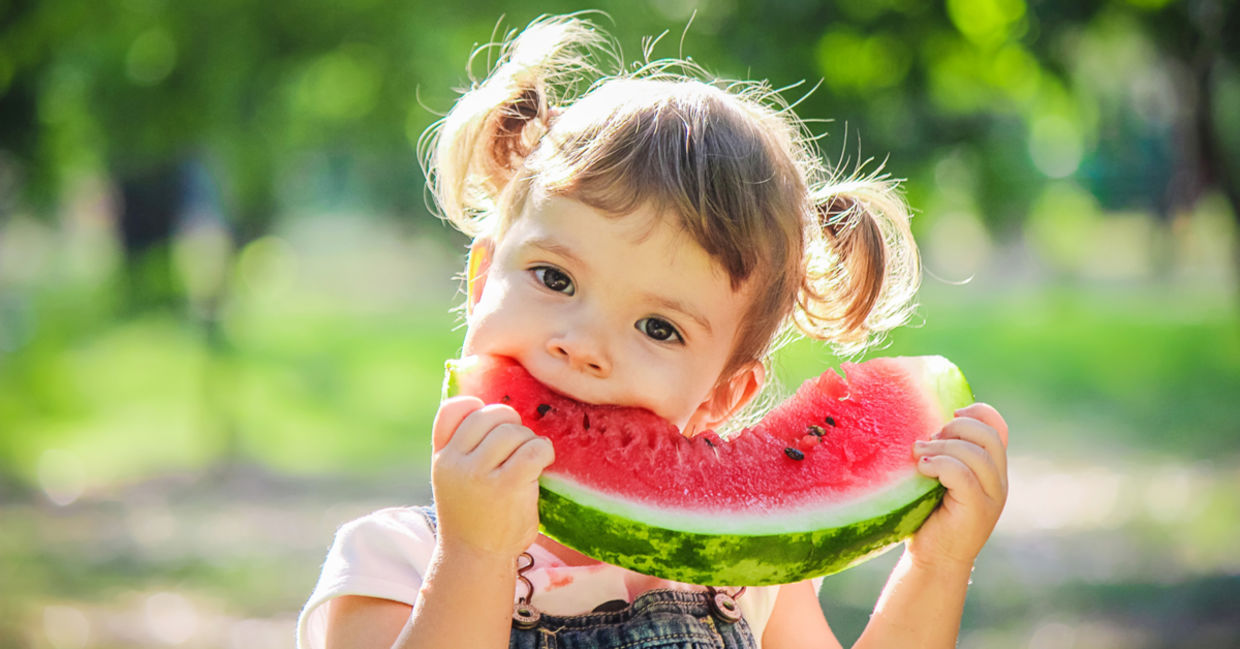Girl eating watermelon.