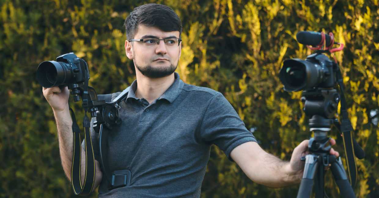 A videographer with two cameras.