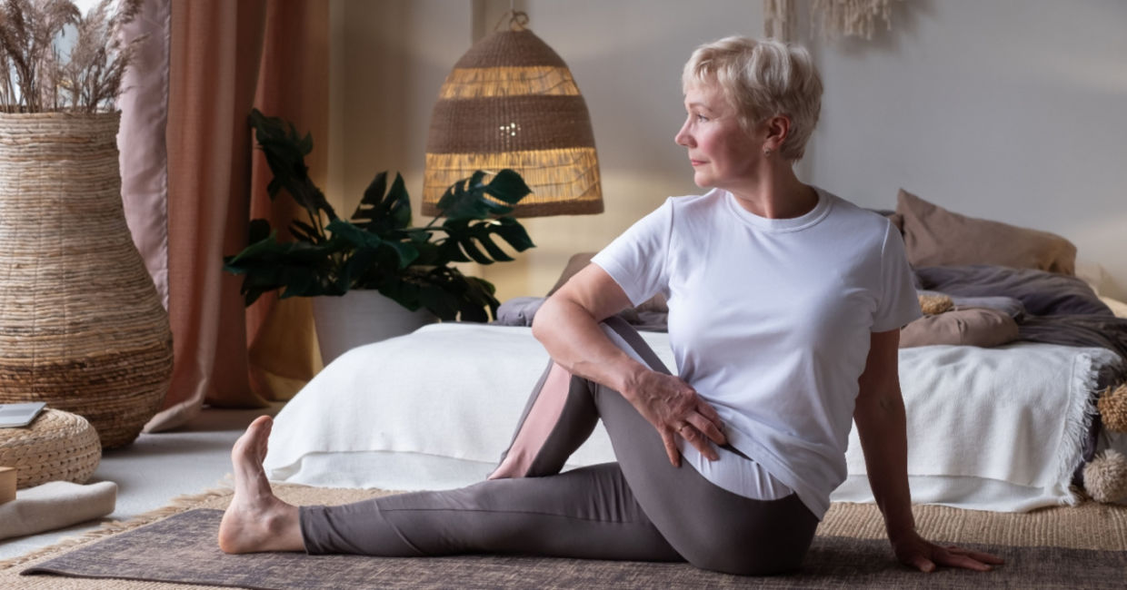 Woman in the seated spinal twist yoga pose.