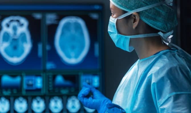 A team of medical doctors perform a surgical operation.