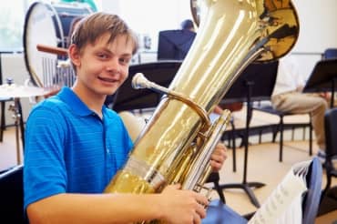 Student playing a tuba.