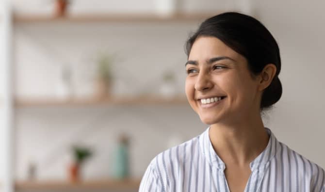 A woman smiles.