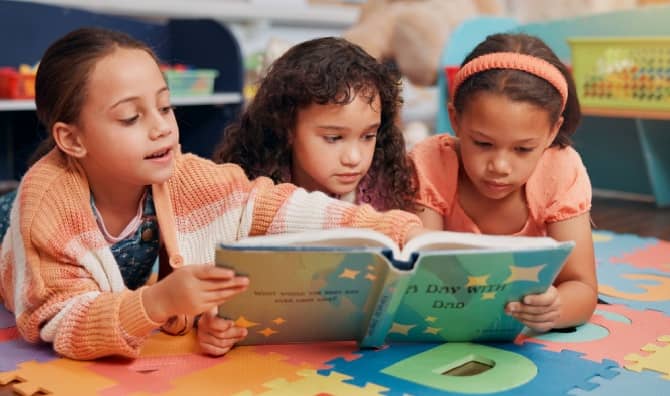 Girls reading books together.