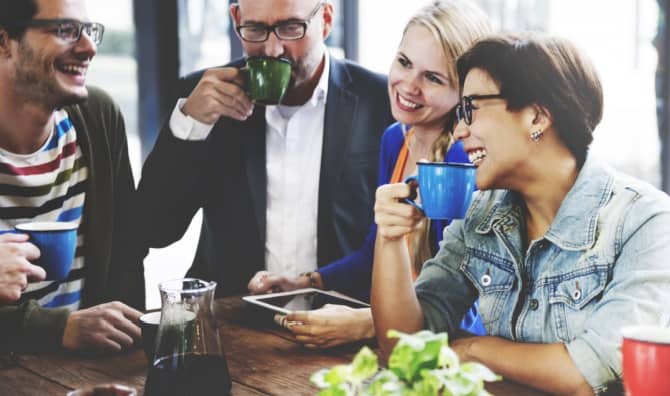 People meet together in a coffee shop.