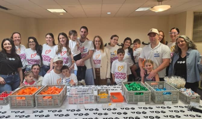 Shari Arison stands with Good Deeds Day volunteers.