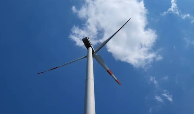 An upward view of a wind turbine.