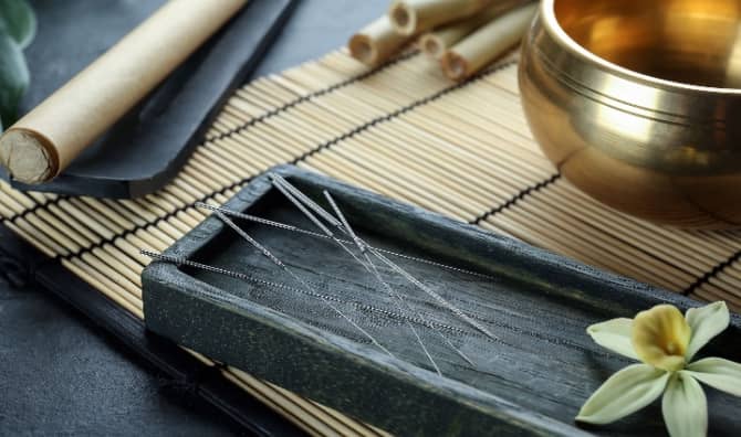 Acupuncture needles on a table.