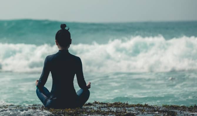 Meditating by the sea.