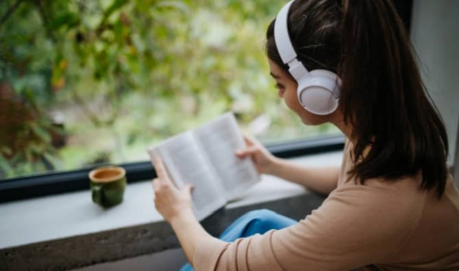 A woman who is immersive reading.