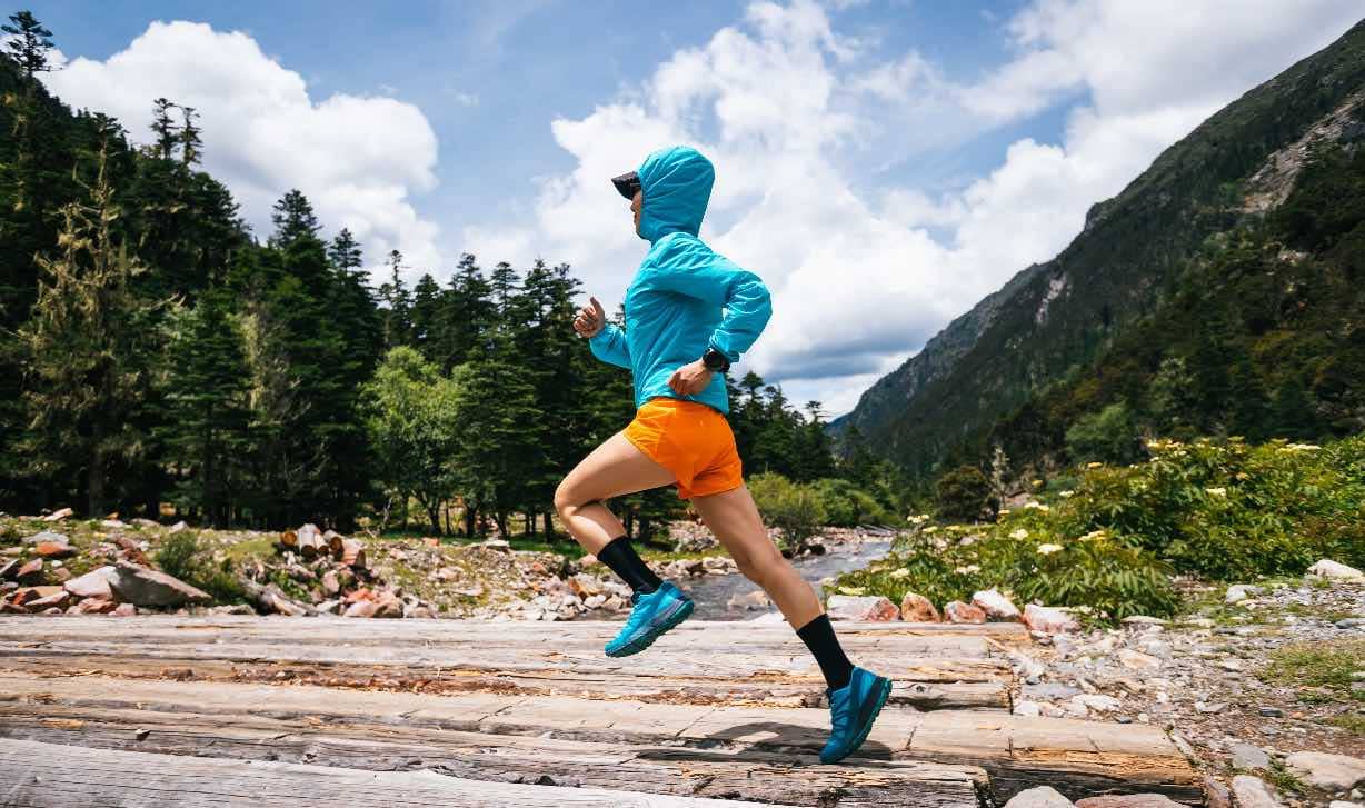 A woman cross country running.