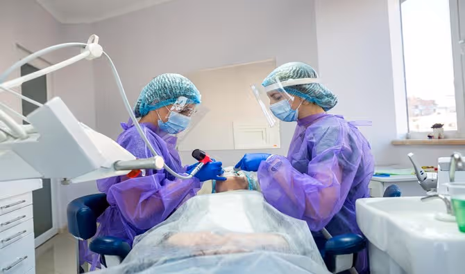 A patient being examined in a dental office.