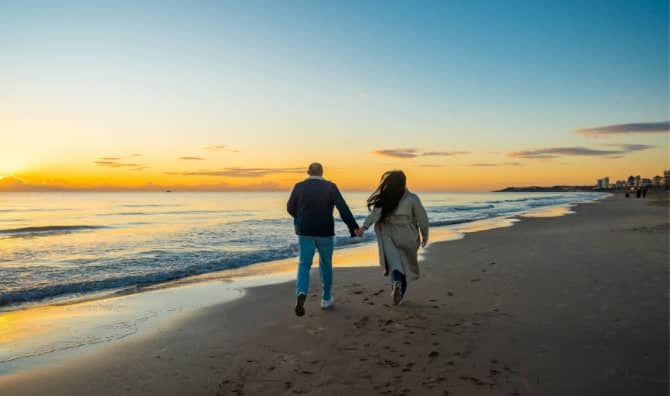 Strolling by the shore at twilight.
