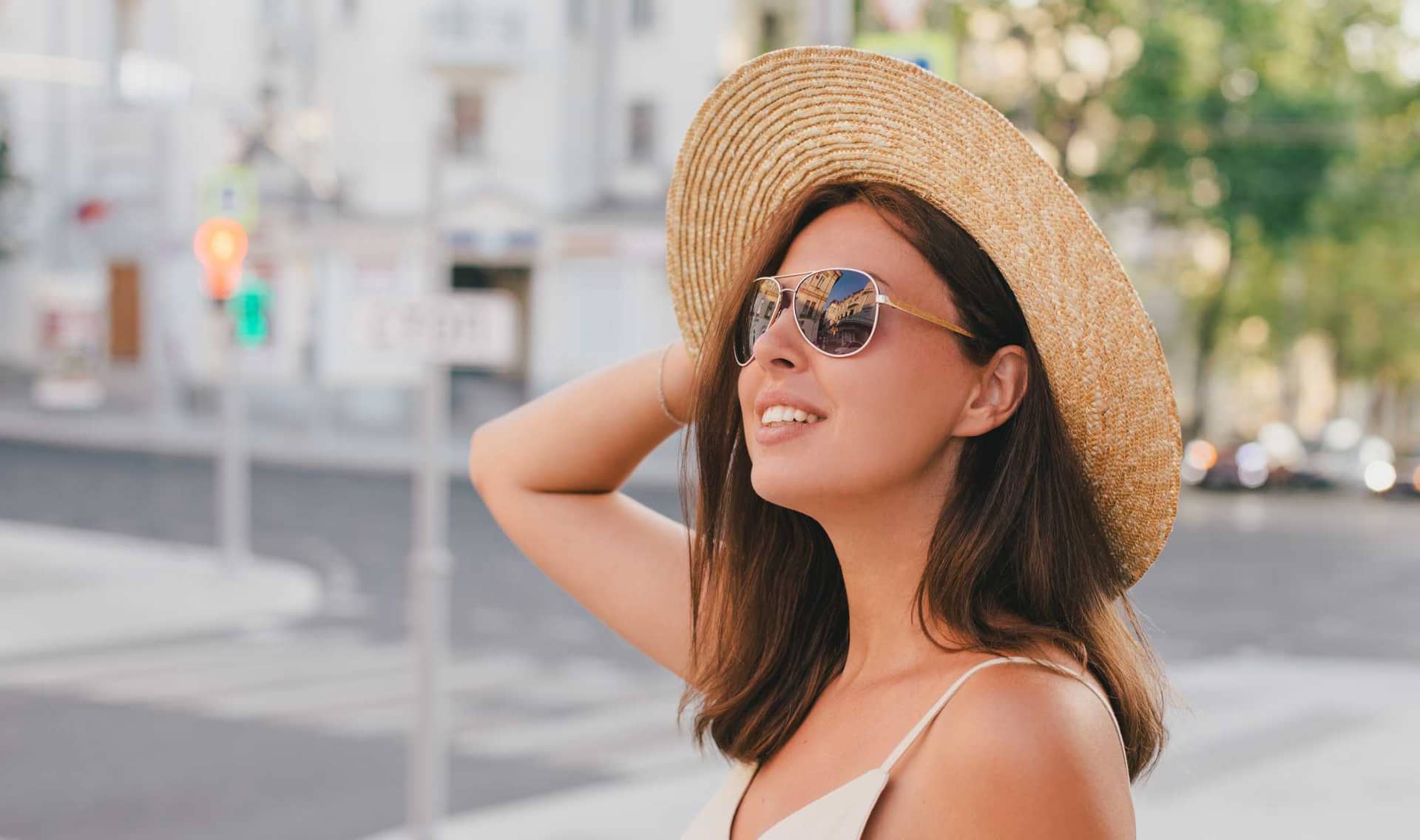 A woman wearing a straw hat.
