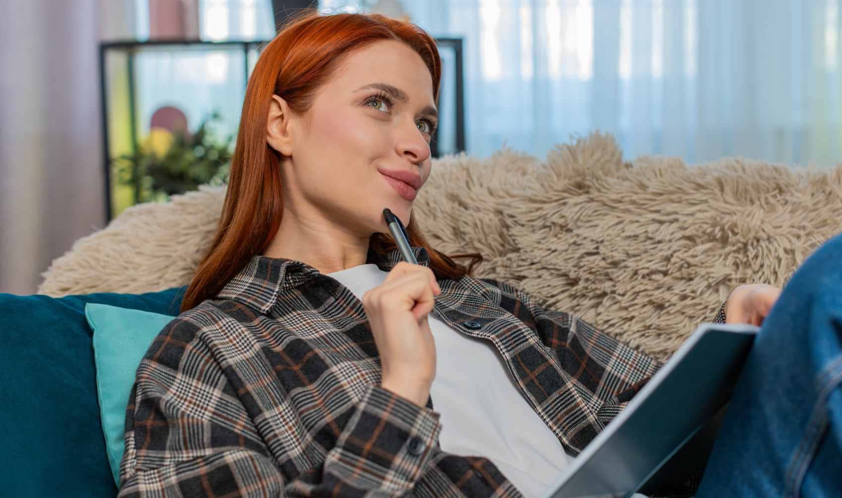 Woman writing her thoughts.