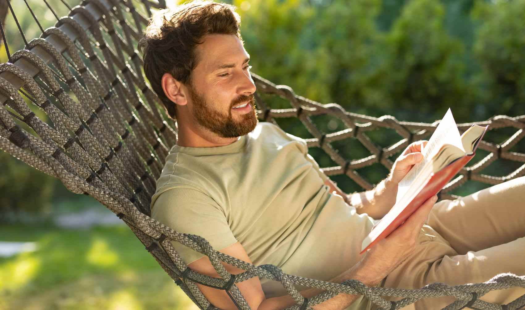 Man reading in a hammock.