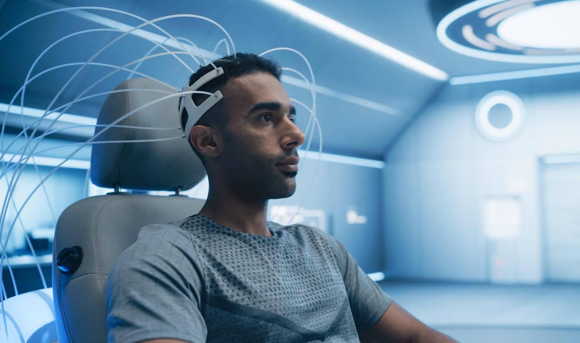 A man wears an EEG headset.