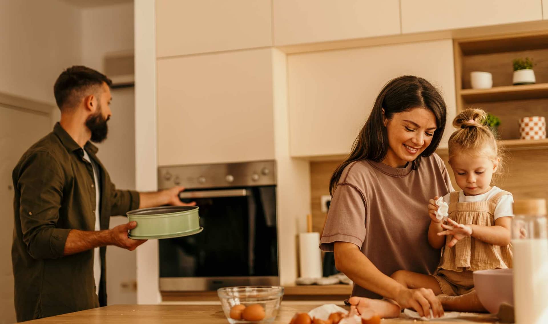 A family in a kitchen.