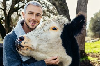 Nathan Runkle poses with a rescued cow