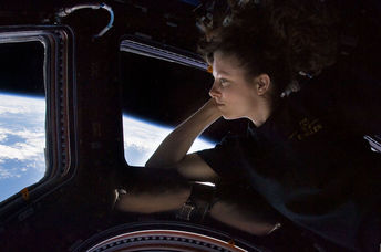 Caldwell Dyson in the Cupola module of the International Space Station observing Earth.