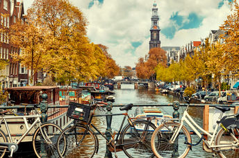 Bicycles stand on a bridge in Amsterdam