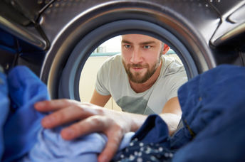 man doing laundry.