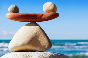 A photograph of stones in balance to convey work life balance