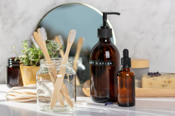 An eco-friendly bathroom with toothbrushes and DIY beauty products.