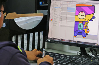 A young animator at work on his computer.