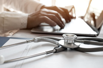 A stethoscope on a laptop