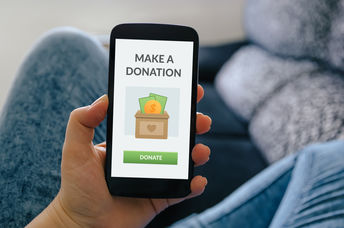 A smartphone with a donate button.