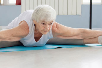 Elderly yoga instructor.