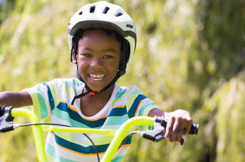 Kid riding a bike.