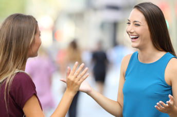 Two friends greeting each other.