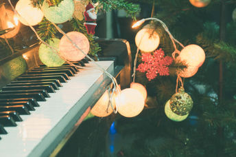 Piano decorated for Christmas.