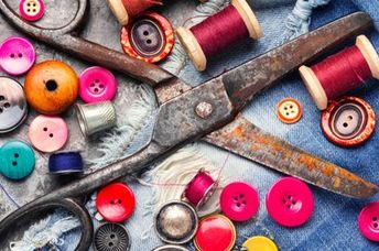 Thread, buttons, and scissors mend and repurpose clothes.