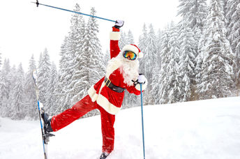 Santa skiing in the mountains over Christmas