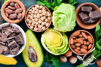 Foods that are rich in magnesium, including dark chocolate, nuts, and avocado.
