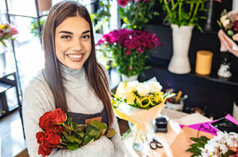 Young woman enjoying learning about flower arranging